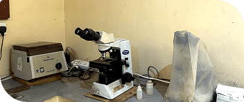 Microscope and centrifuge on the laboratory bench at Banby Specialist Hospital