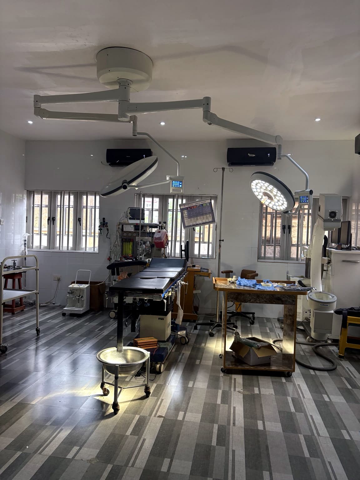 Operating theatre at Banby Specialist Hospital in Ibadan, with twin surgical lights above the operating table