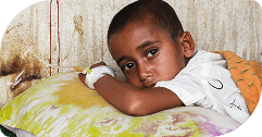 A young child resting on a pillow